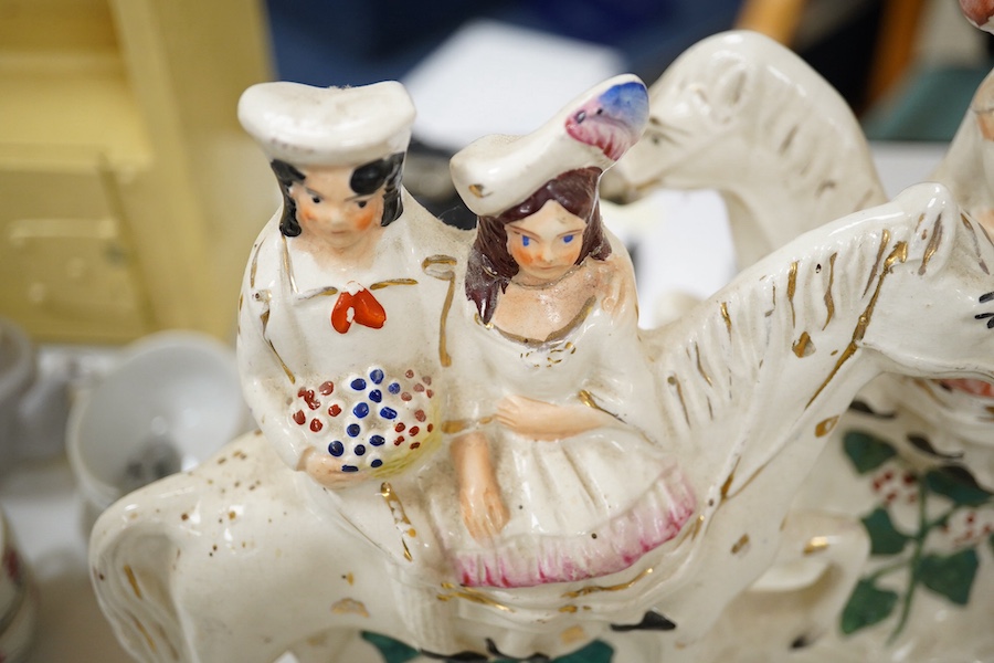 A pair of 19th century Staffordshire pottery models of Zebra, two pairs of Staffordshire pottery equestrian groups, largest 21cm high (6) Condition - some minor breaks and repairs